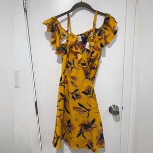 Small Charlotte Russe mustard floral tie up dress. Never worn